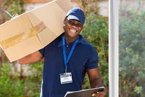 Image showing a man carrying a package for delivery.